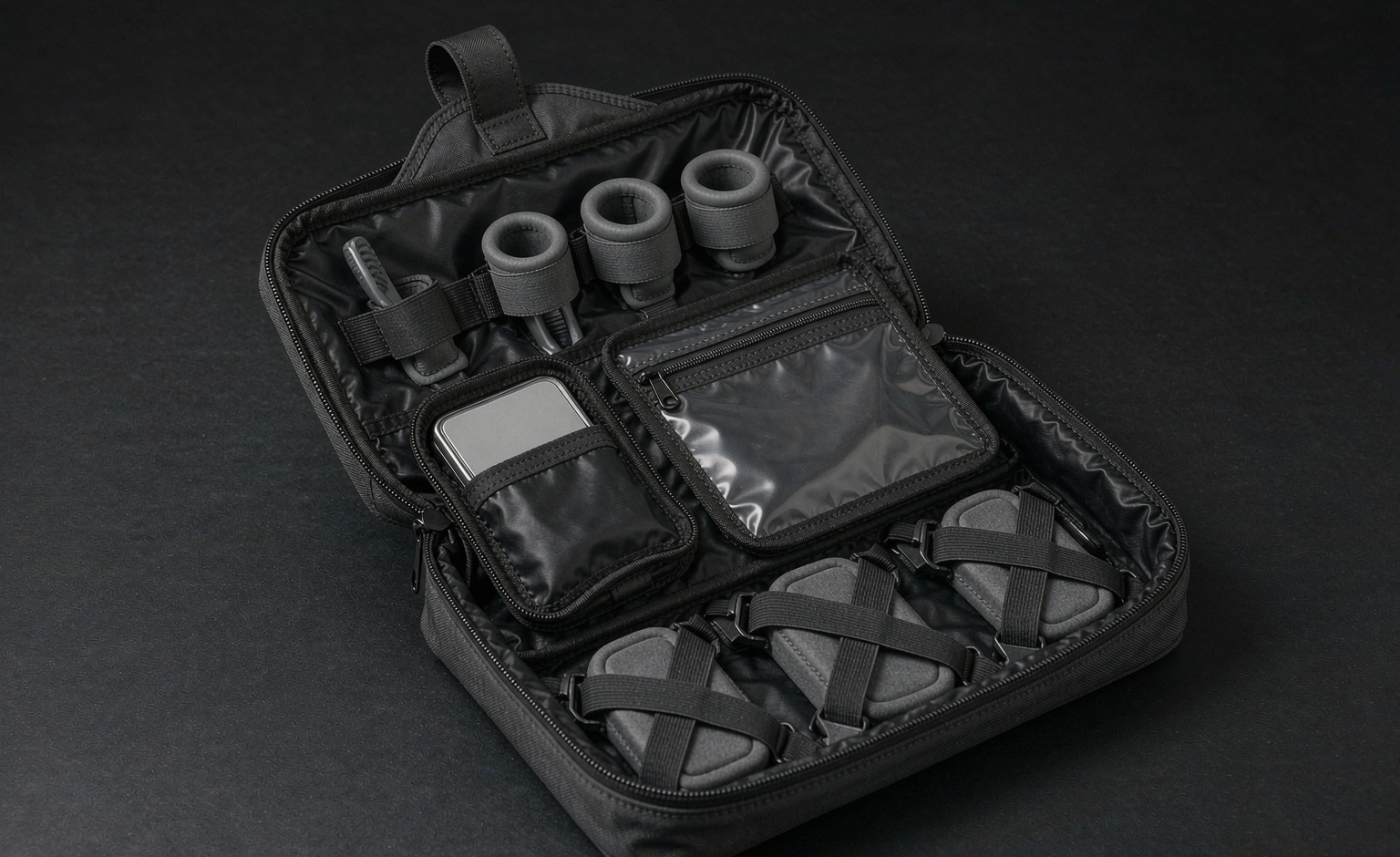 Open hanging toiletry module with brush loops, clear pocket and bottle retainers